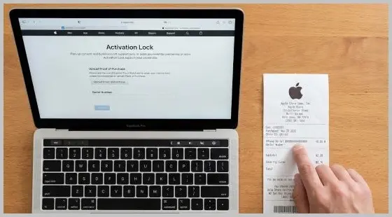Original Apple Store receipt placed next to a laptop displaying the official Apple Activation Lock support page.